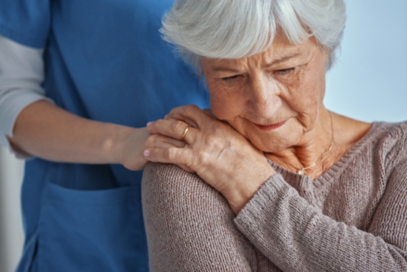 Compassionate Nurse supports dementia care elderly woman at Alpine Skilled Nursing in Ruston, LA