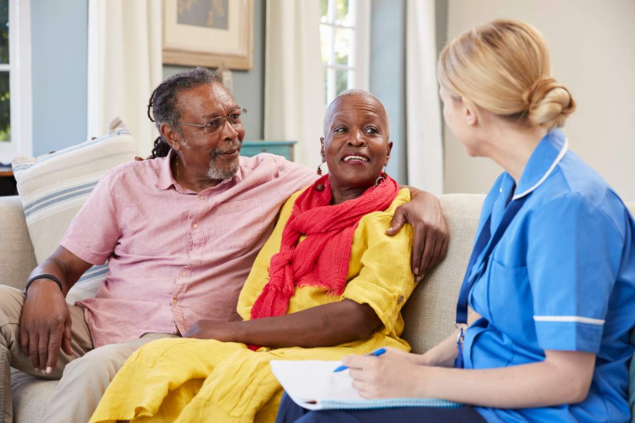 A nurse engages with an elderly woman and an elderly man about Skilled Nursing needs at Aline Skilled Nursing & Rehabilitation in Ruston, LA.