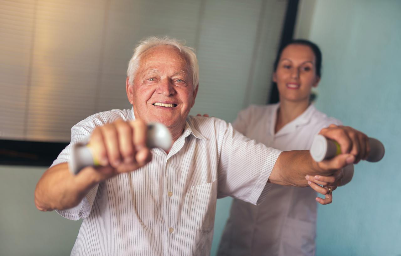 elderly man in outpatient therapy session with professional care team at Alpine Skilled Nursing in Ruston, LA